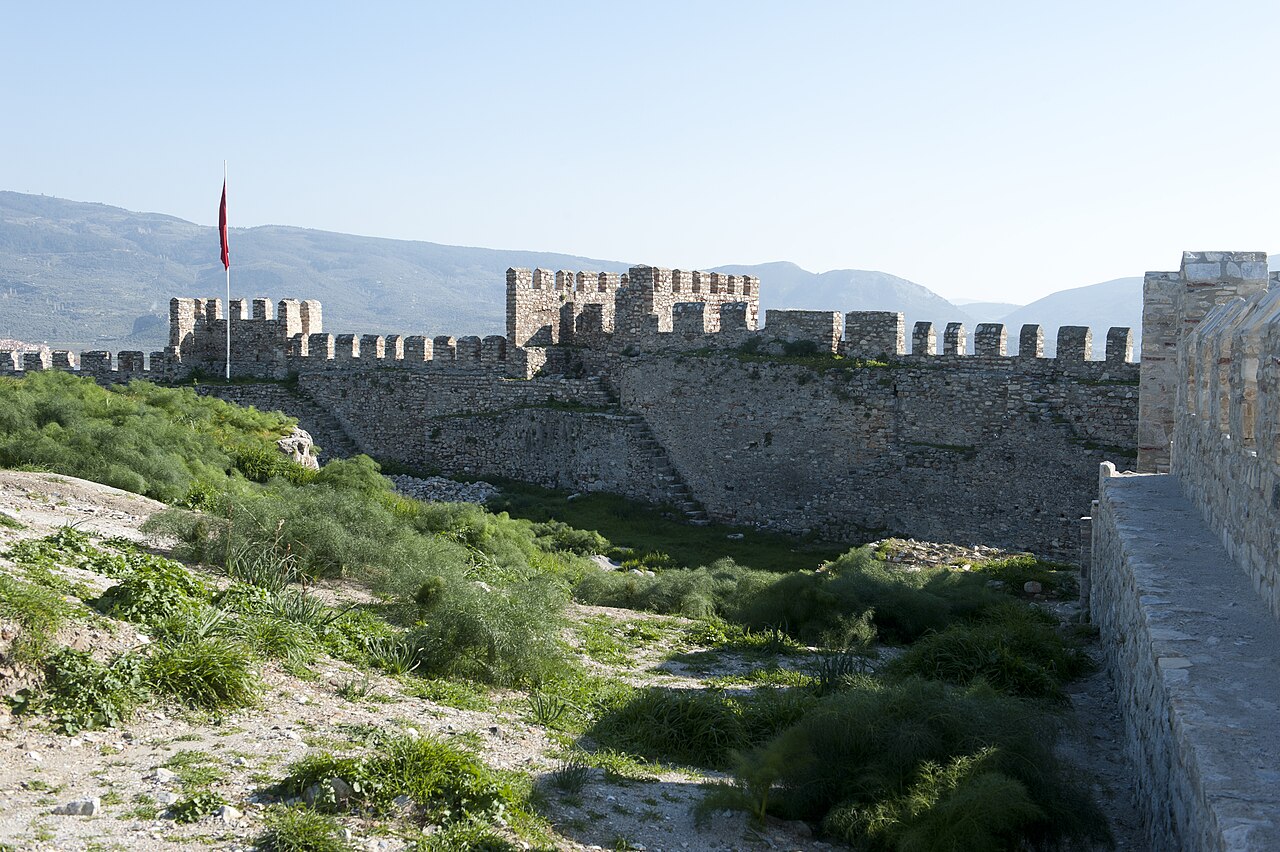 Interior ground and long stone wall of Ayasuluk Castle with the hills beyond
