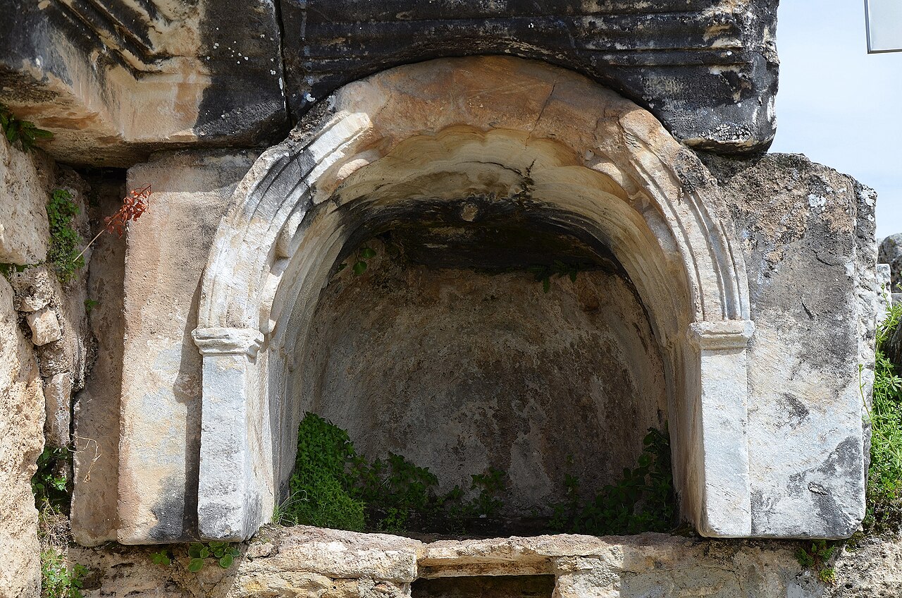 Close view of a stone arched recess associated with the Ploutonion at Hierapolis